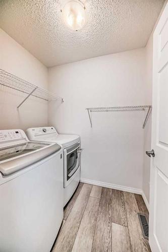 144 Lucas Street Nw, Calgary, AB - Indoor Photo Showing Laundry Room