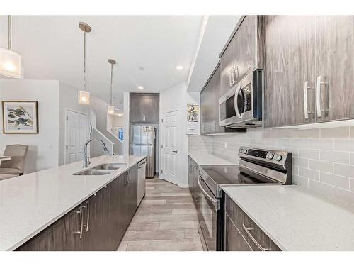 144 Lucas Street Nw, Calgary, AB - Indoor Photo Showing Kitchen With Double Sink With Upgraded Kitchen