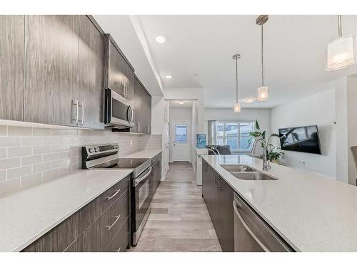 144 Lucas Street Nw, Calgary, AB - Indoor Photo Showing Kitchen With Double Sink With Upgraded Kitchen