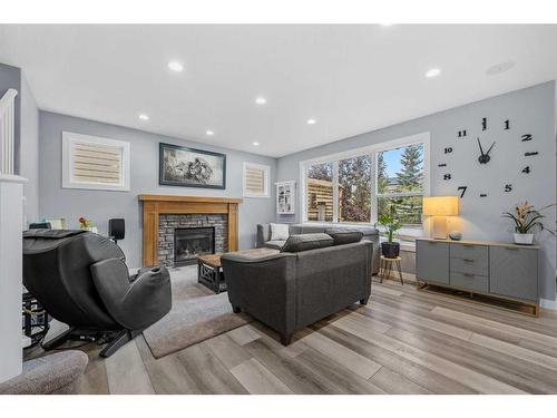 224 Auburn Sound View Se, Calgary, AB - Indoor Photo Showing Living Room With Fireplace