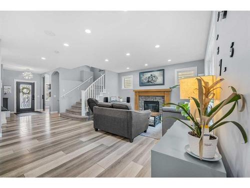 224 Auburn Sound View Se, Calgary, AB - Indoor Photo Showing Other Room With Fireplace