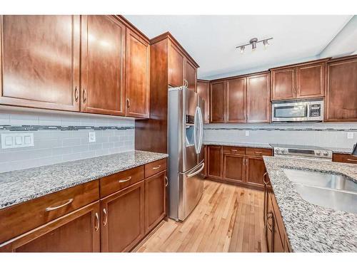 183 Hillcrest Circle Sw, Airdrie, AB - Indoor Photo Showing Kitchen With Double Sink