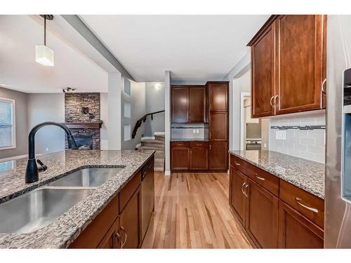 183 Hillcrest Circle Sw, Airdrie, AB - Indoor Photo Showing Kitchen With Double Sink