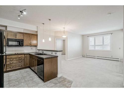 453-26 Val Gardena View Sw, Calgary, AB - Indoor Photo Showing Kitchen With Double Sink