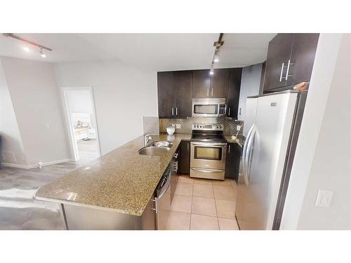 608-210 15 Avenue Se, Calgary, AB - Indoor Photo Showing Kitchen With Stainless Steel Kitchen With Double Sink