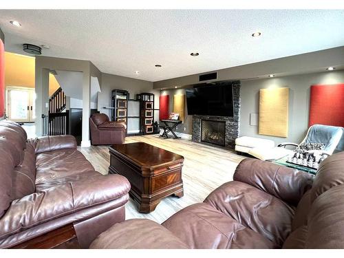 27 Calling Horse Estates, Rural Rocky View County, AB - Indoor Photo Showing Living Room With Fireplace