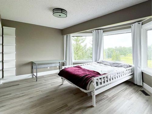 27 Calling Horse Estates, Rural Rocky View County, AB - Indoor Photo Showing Bedroom