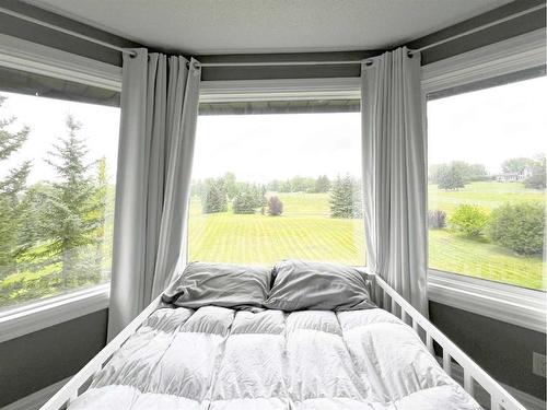 27 Calling Horse Estates, Rural Rocky View County, AB - Indoor Photo Showing Bedroom