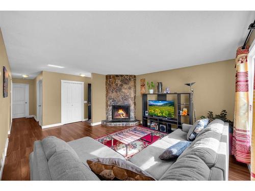 63 Whitnel Close Ne, Calgary, AB - Indoor Photo Showing Living Room With Fireplace