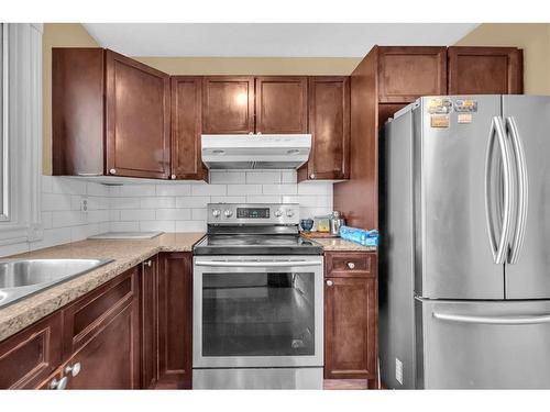 63 Whitnel Close Ne, Calgary, AB - Indoor Photo Showing Kitchen