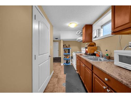 63 Whitnel Close Ne, Calgary, AB - Indoor Photo Showing Kitchen With Double Sink