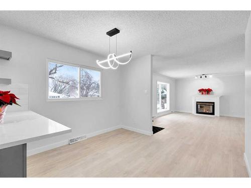 2033 Cottonwood Crescent Se, Calgary, AB - Indoor With Fireplace