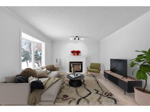 2033 Cottonwood Crescent Se, Calgary, AB - Indoor Photo Showing Living Room With Fireplace