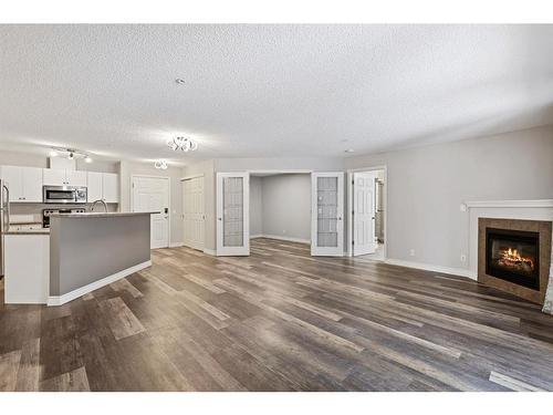 122-1808 36 Avenue Sw, Calgary, AB - Indoor With Fireplace