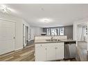 122-1808 36 Avenue Sw, Calgary, AB  - Indoor Photo Showing Kitchen With Double Sink 