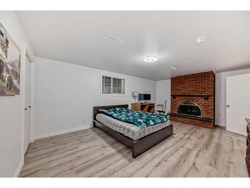 610 69 Avenue Sw, Calgary, AB - Indoor Photo Showing Bedroom With Fireplace