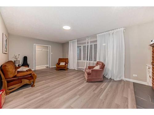 610 69 Avenue Sw, Calgary, AB - Indoor Photo Showing Living Room With Fireplace