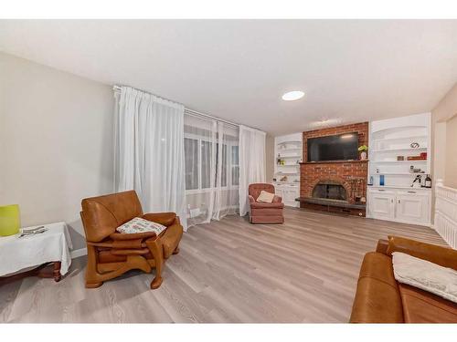 610 69 Avenue Sw, Calgary, AB - Indoor Photo Showing Living Room With Fireplace