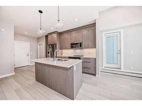 1402-395 Skyview Parkway Ne, Calgary, AB - Indoor Photo Showing Kitchen With Stainless Steel Kitchen With Double Sink With Upgraded Kitchen