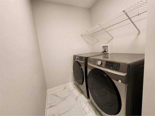 193 Lucas Place Nw, Calgary, AB - Indoor Photo Showing Laundry Room