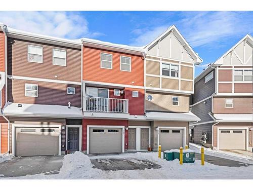 204-1225 Kings Heights Way Se, Airdrie, AB - Outdoor With Balcony With Facade