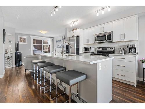 204-1225 Kings Heights Way Se, Airdrie, AB - Indoor Photo Showing Kitchen With Stainless Steel Kitchen With Upgraded Kitchen