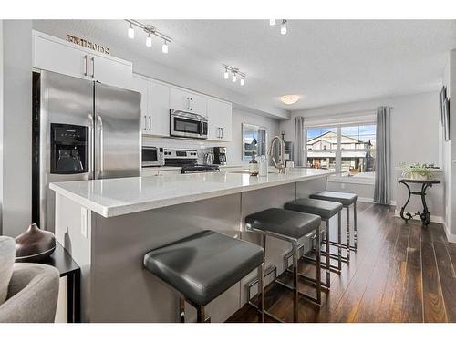 204-1225 Kings Heights Way Se, Airdrie, AB - Indoor Photo Showing Kitchen With Stainless Steel Kitchen With Upgraded Kitchen