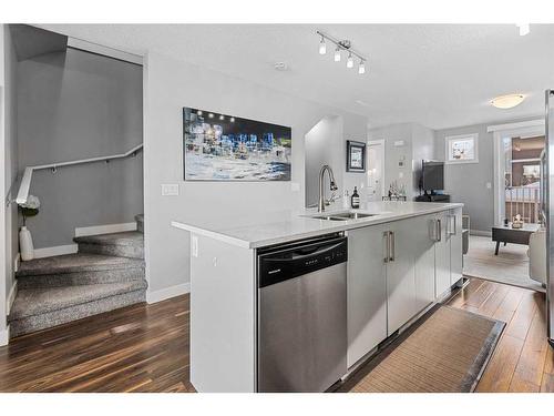 204-1225 Kings Heights Way Se, Airdrie, AB - Indoor Photo Showing Kitchen With Double Sink