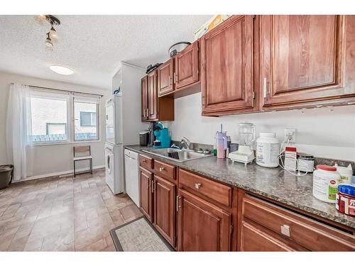 135 Carr Crescent, Okotoks, AB - Indoor Photo Showing Kitchen With Double Sink