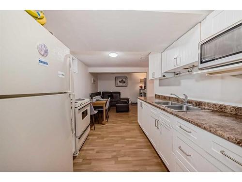 135 Carr Crescent, Okotoks, AB - Indoor Photo Showing Kitchen With Double Sink