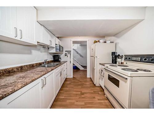 135 Carr Crescent, Okotoks, AB - Indoor Photo Showing Kitchen With Double Sink