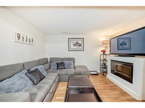 135 Carr Crescent, Okotoks, AB - Indoor Photo Showing Living Room With Fireplace