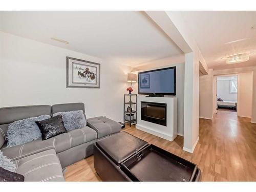 135 Carr Crescent, Okotoks, AB - Indoor Photo Showing Living Room With Fireplace