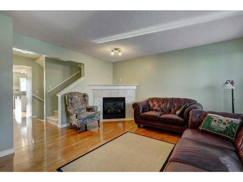 7975 Wentworth Drive Sw, Calgary, AB - Indoor Photo Showing Living Room With Fireplace