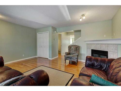 7975 Wentworth Drive Sw, Calgary, AB - Indoor Photo Showing Living Room With Fireplace