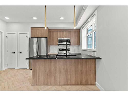 301-562 Seton Circle Se, Calgary, AB - Indoor Photo Showing Kitchen With Stainless Steel Kitchen