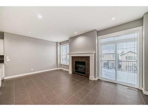 59 Nolanlake View Nw, Calgary, AB - Indoor Photo Showing Living Room With Fireplace