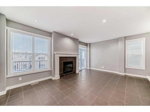 59 Nolanlake View Nw, Calgary, AB - Indoor Photo Showing Living Room With Fireplace