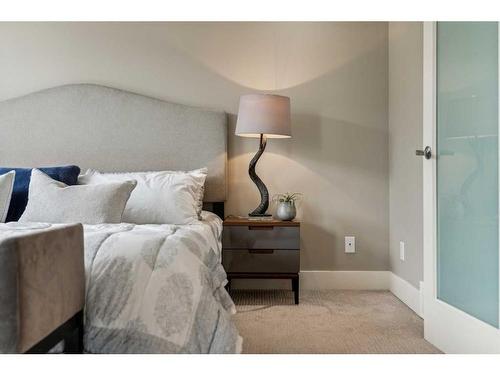 156 Rainbow Falls Glen, Chestermere, AB - Indoor Photo Showing Bedroom