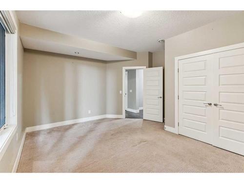 156 Rainbow Falls Glen, Chestermere, AB - Indoor Photo Showing Other Room