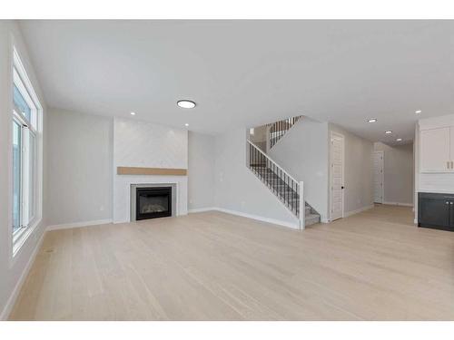 15 South Shore Road, Chestermere, AB - Indoor Photo Showing Living Room With Fireplace