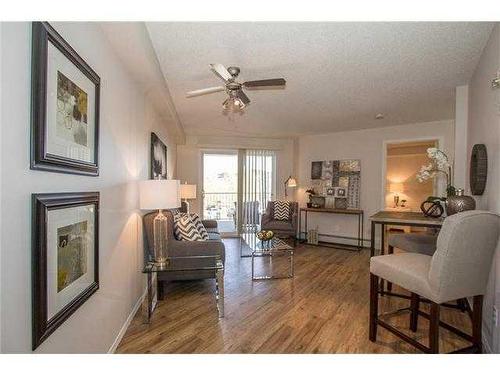 5208-604 8 Street Sw, Airdrie, AB - Indoor Photo Showing Living Room With Fireplace