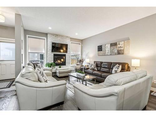 3441 Kerry Park Road Sw, Calgary, AB - Indoor Photo Showing Living Room With Fireplace