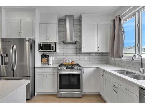 212 Cornergate Row Ne, Calgary, AB - Indoor Photo Showing Kitchen With Stainless Steel Kitchen With Double Sink With Upgraded Kitchen