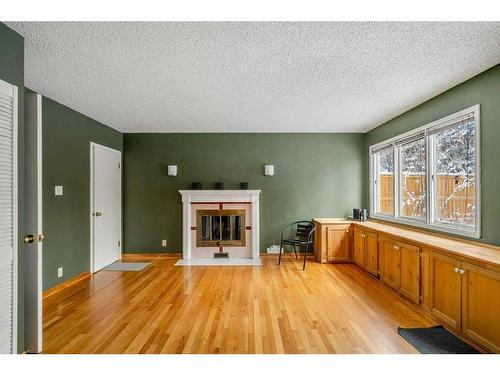 4028 Chatham Place Nw, Calgary, AB - Indoor Photo Showing Other Room With Fireplace