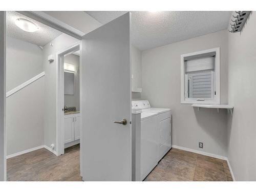 12 Riverwood Crescent Se, Calgary, AB - Indoor Photo Showing Laundry Room