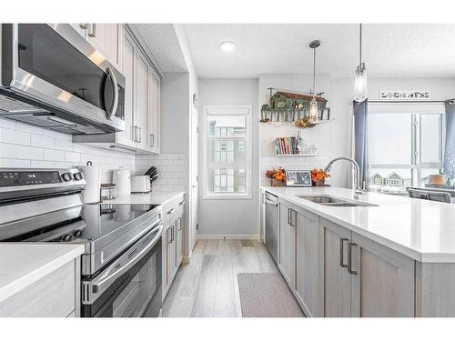 315-40 Carrington Plaza Nw, Calgary, AB - Indoor Photo Showing Kitchen With Double Sink With Upgraded Kitchen