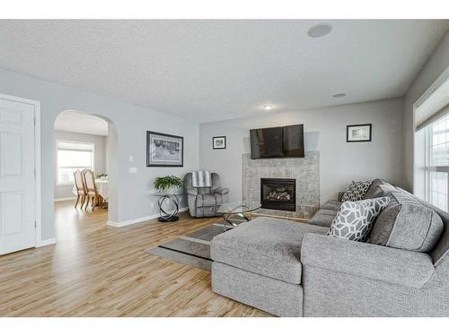 137 West Creek Glen, Chestermere, AB - Indoor Photo Showing Living Room With Fireplace