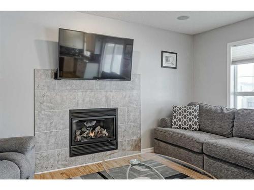 137 West Creek Glen, Chestermere, AB - Indoor Photo Showing Living Room With Fireplace