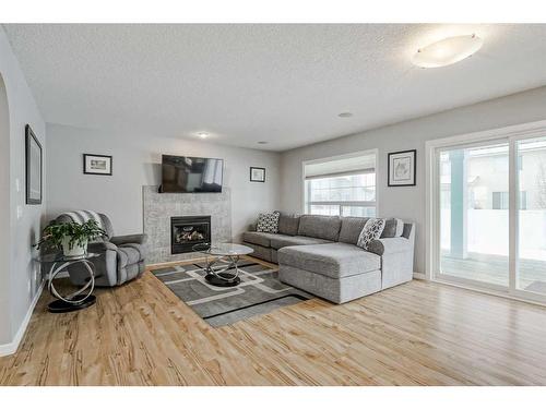 137 West Creek Glen, Chestermere, AB - Indoor Photo Showing Living Room With Fireplace